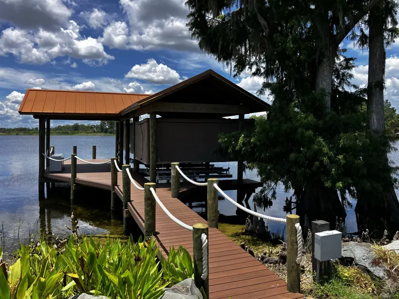 Boathouse with a metal roof and rope-rail walkway built by Capital Marine Construction