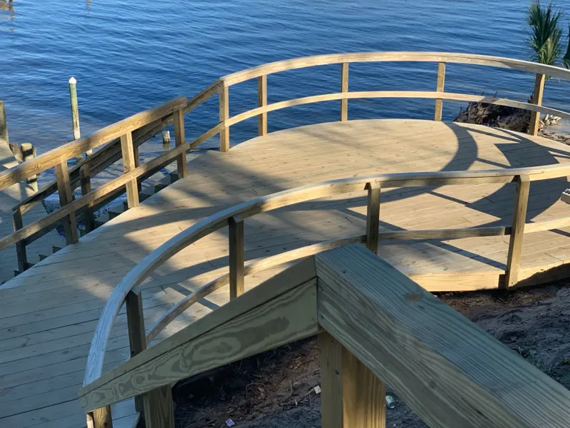 Curved waterfront deck with railing
