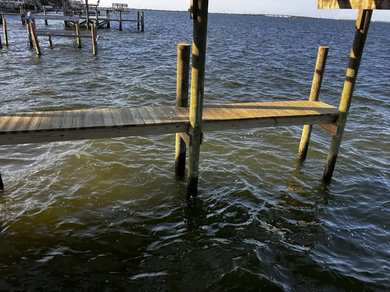 Fixed dock on pilings over the river