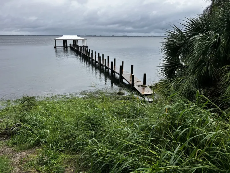 Long fixed pier with covered end platform