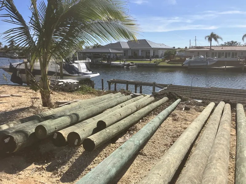 Marine pilings staged on site before driving