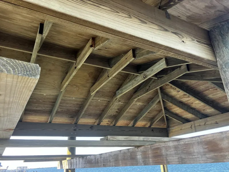 Hip-roof framing over a boat slip